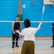 Students playing badminton in the sports centre