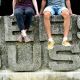 close-up of the famous Sussex sign with two students