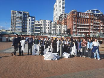 Our Silent Disco Beach Clean Volunteers stand with their 18kg of waste