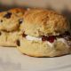 Two scones with cream and jam