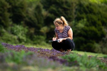 Student conducting research outdoors