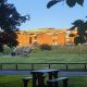 A photo of the Library building at University of Sussex with a picnic bench in the foreground