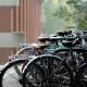 A photo of a row of bikes on the University of Sussex campus