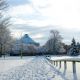 The Meeting House stands out in the background surrounded by the fields around Library covered in snow