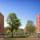 Health and Wellbeing Centre (left) and student residence (right) with a large green space with trees in between