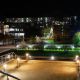 The University of Sussex campus at night with lights on