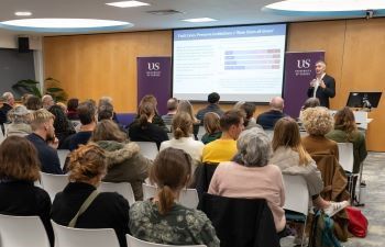 Luke Tryl speaks to audience