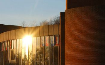 Sunlight reflecting on the glass of the café at the Attenborough Centre for the Creative Arts