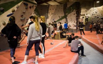 Young people in an indoor climbing centre