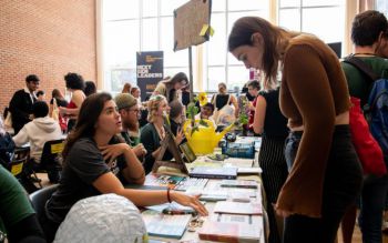 A students asking information about one of the societies at the Freshers Fair in September 2022