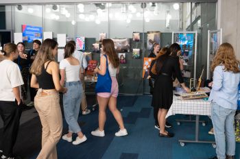 Students look around the exhibition showcasing Award participants' creative work