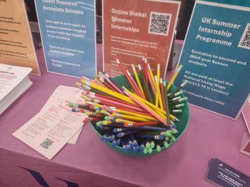 a pot of pencils and leaflets