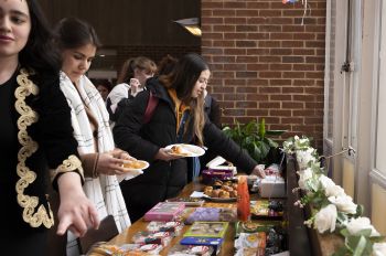 Students choose from a range of international foods at a One World Week event.