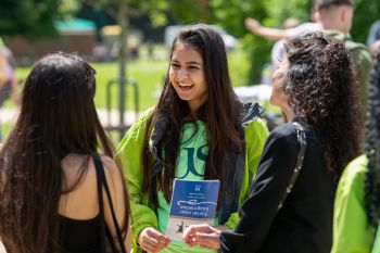 An Ambassador helping visitors