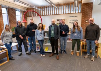 Photograph of eight members of the Library Student Experience team