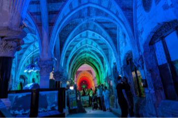 A photograph of the Victorian Arcade lit up with coloured light