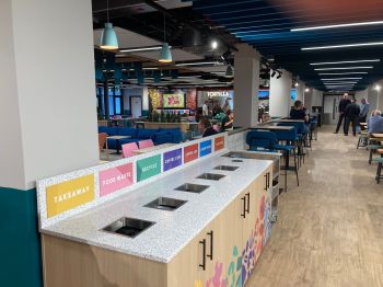 One of the new recycling banks in Eat Central, with the restaurant behind it