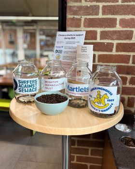 Participants voted by placing two coffee beans in the jars representing their favourite charities