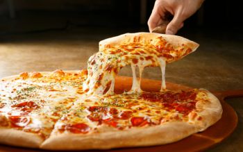 An image of pizza being served