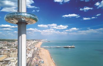 An image of the Brighton i360 with palace pier shown in background