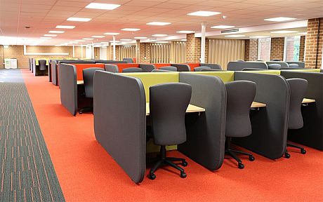 Chairs and desks in a refurbished Library study space