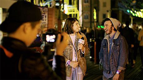 A Sussex digital guru student interviews someone in the street