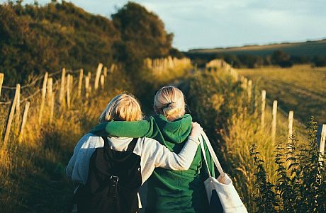 Two young women walking in the countryside