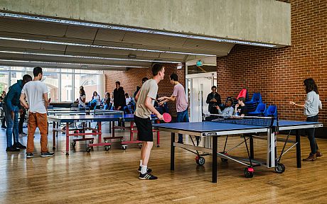 Students playing table tennis in Mandela Hall
