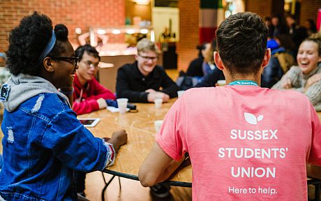 Students around a table in the Students' Union