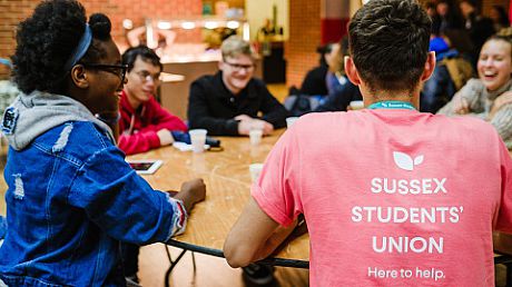 Students around a table in the Students' Union