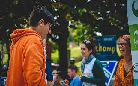 Student talking to environmental charity worker