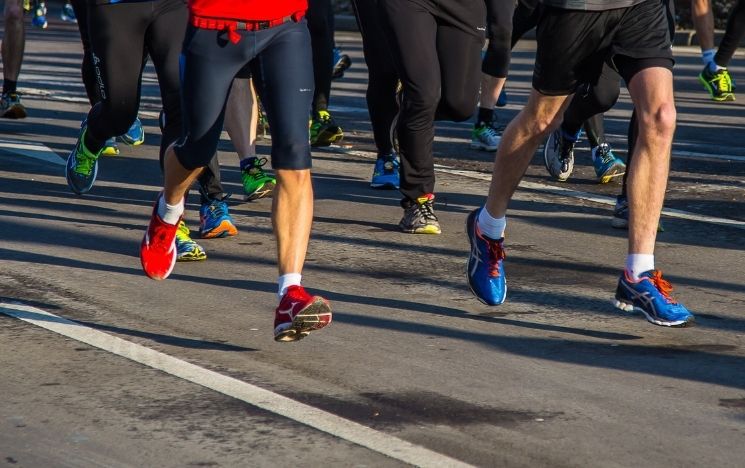 Legs of people running a marathon