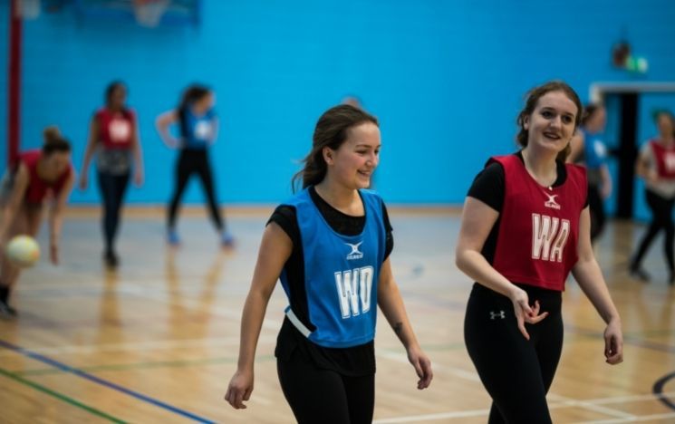 female students playing sports