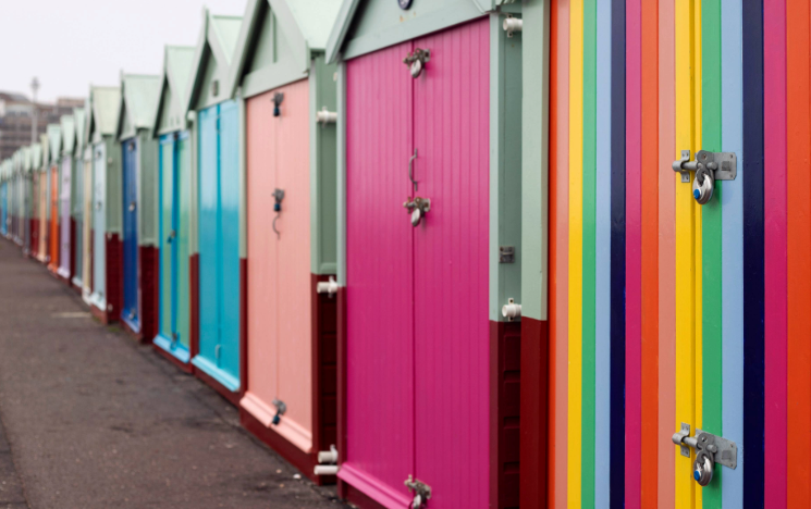 Brightly coloured beach huts on Brighton seafront