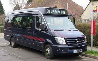 a dark blue minibus with room for about 15 people