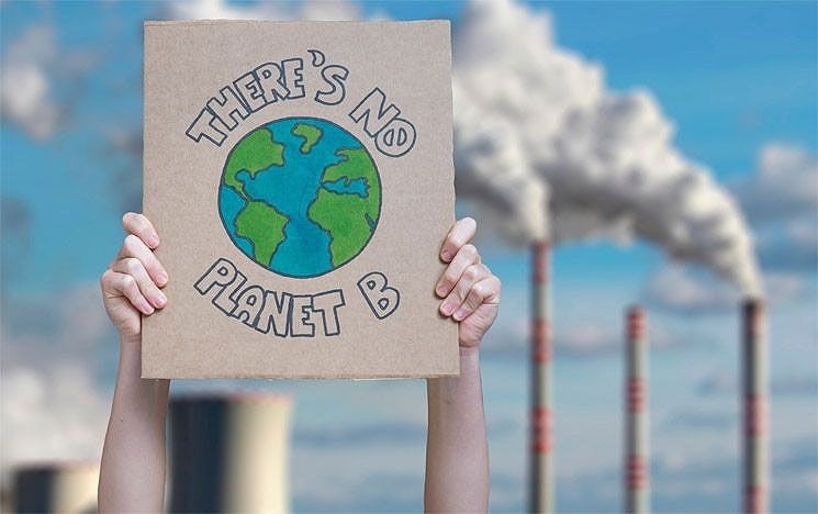 A pair of hands holding up a placard that says There's No Planet B
