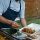 Sussex Uni Food cook serving food on campus