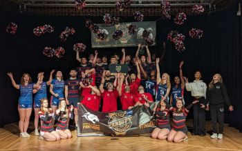 sports teams celebrating Sussex Varsity win