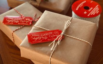 Gift wrapped in brown paper and tied with a bow