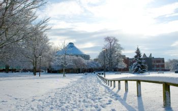 Snow on campus with Meeting House and Falmer House in the background