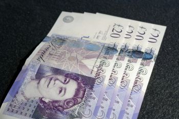 A photograph of twenty pound notes.